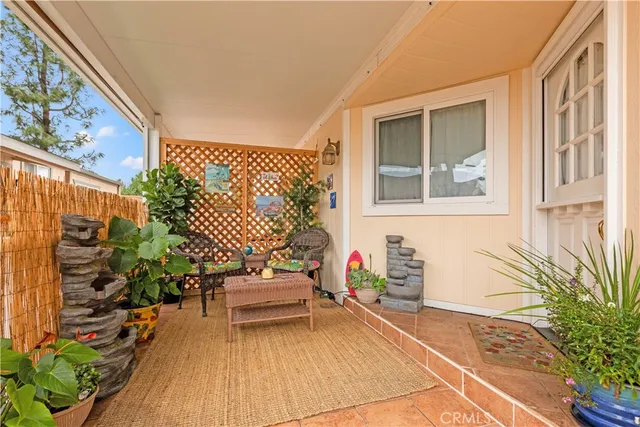 a backyard of a house with outdoor seating