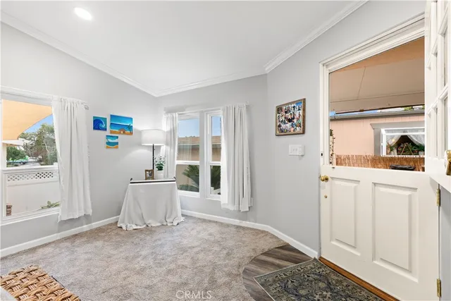 a living room with a couch and a window