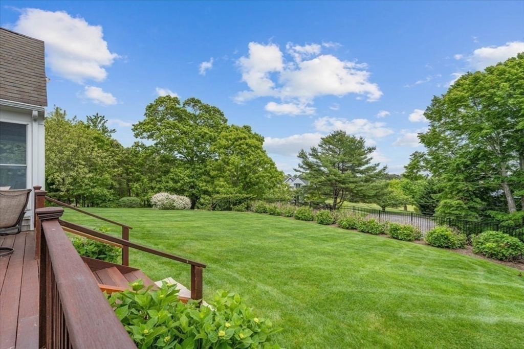 89 Standish Road Bourne, MA 02562 - Photo 34 of 39 a view of a garden with a building in the background