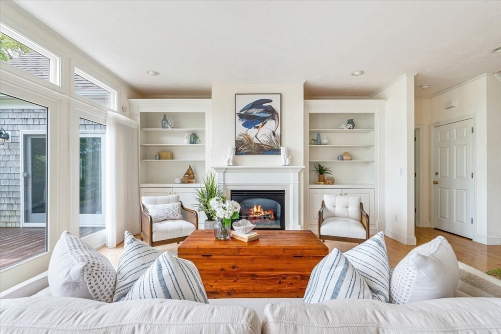 89 Standish Road Bourne, MA 02562 - Photo 8 of 39 a bedroom with a bed and a fireplace