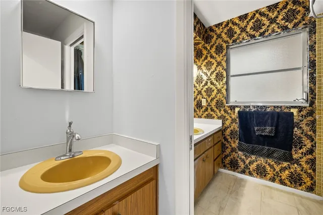 a bathroom with a sink and a mirror