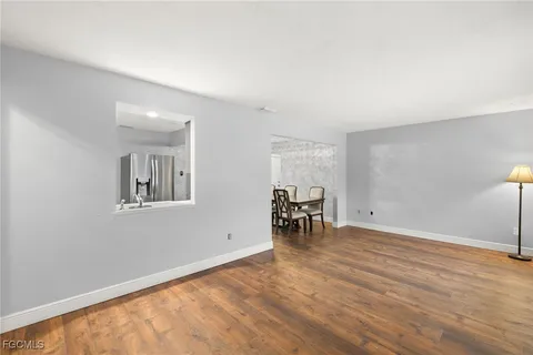 a view of work space with furniture and wooden floor