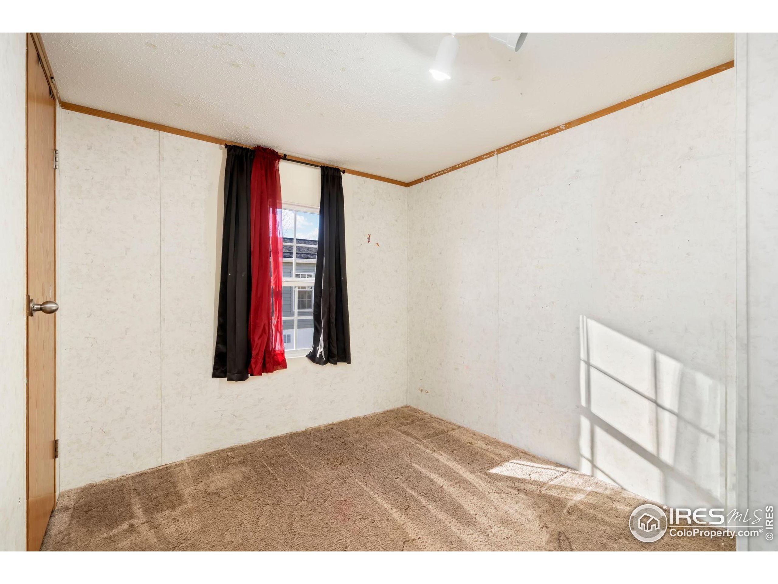 2500 East Harmony Road, Unit 166 Fort Collins, CO 80528 - Photo 16 of 24 a view of an empty room with a window