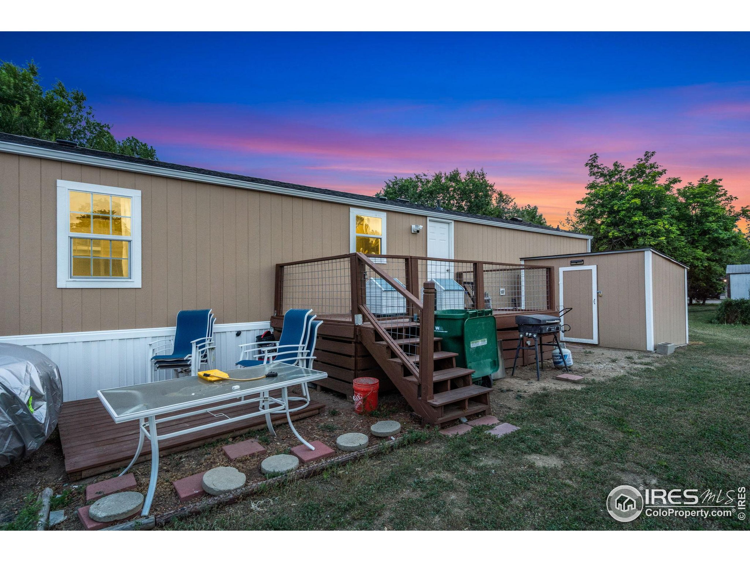 2500 East Harmony Road, Unit 166 Fort Collins, CO 80528 - Photo 24 of 24 a view of a backyard with furniture and a patio