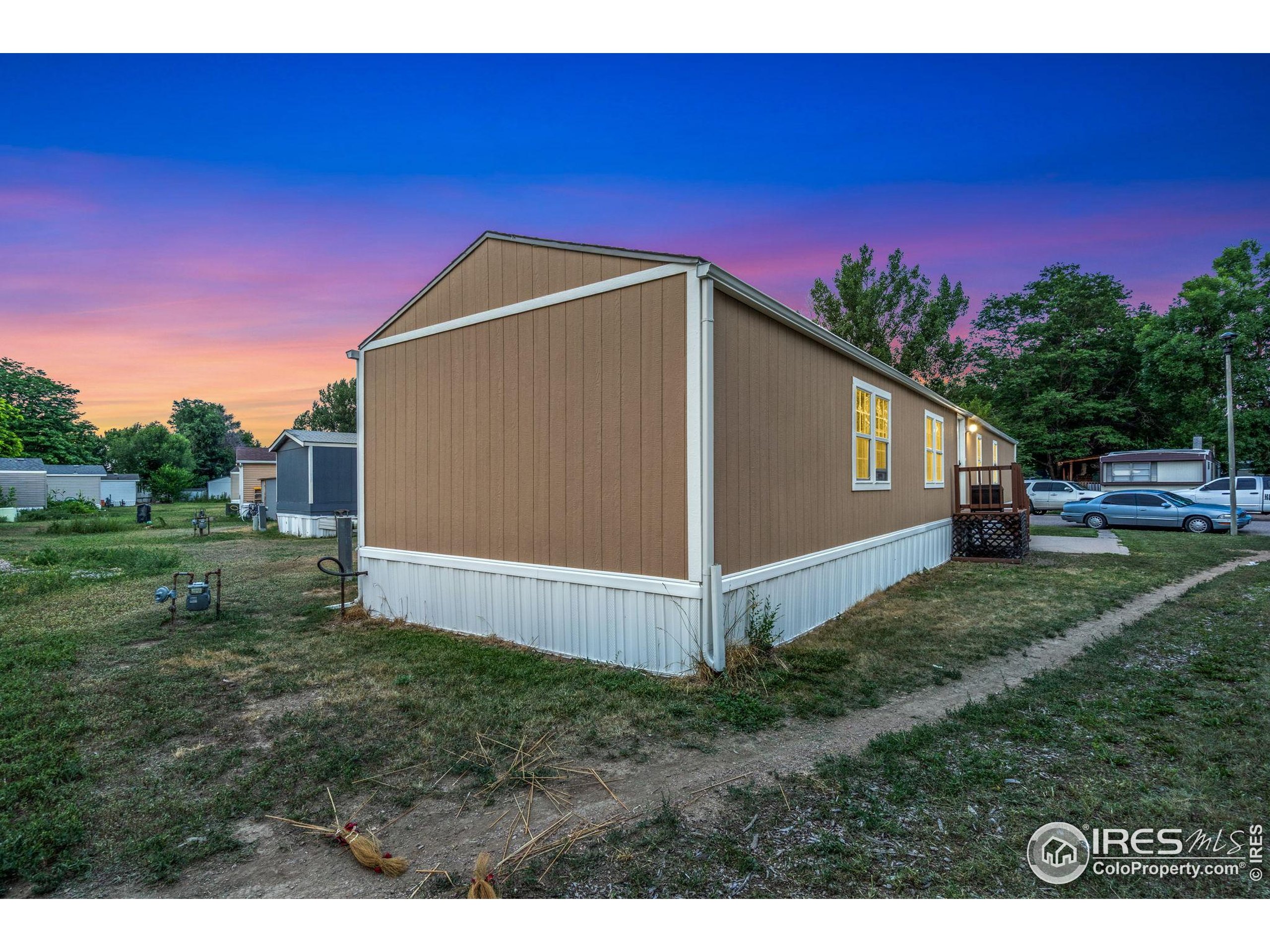 2500 East Harmony Road, Unit 166 Fort Collins, CO 80528 - Photo 4 of 24 a view of a backyard