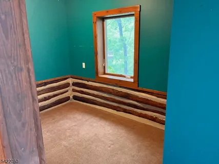 a view of room with window and stairs