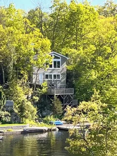 a house with swimming pool in front of it