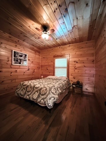 5575 Rainbow Springs Road Franklin, NC 28734 - Photo 23 of 35 a bed sitting in a bedroom next to a window
