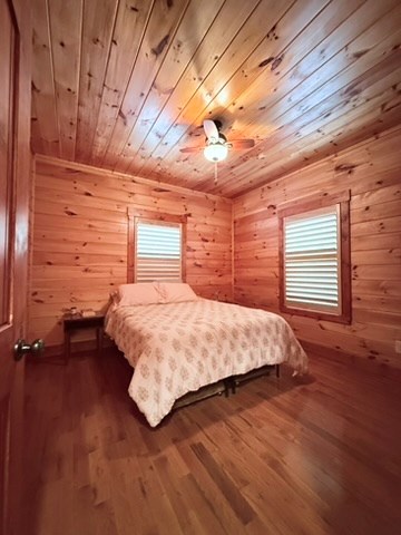 5575 Rainbow Springs Road Franklin, NC 28734 - Photo 24 of 35 a bed sitting in a spacious bedroom next to a window
