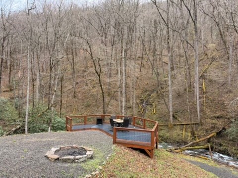 5575 Rainbow Springs Road Franklin, NC 28734 - Photo 29 of 35 a bench sitting in middle of a yard