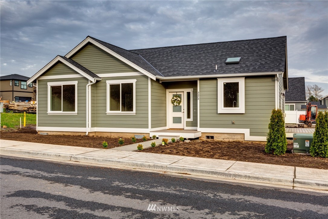 5578 South Church Road Ferndale, WA 98248 - Photo 1 of 36 a front view of a house with a yard and garage