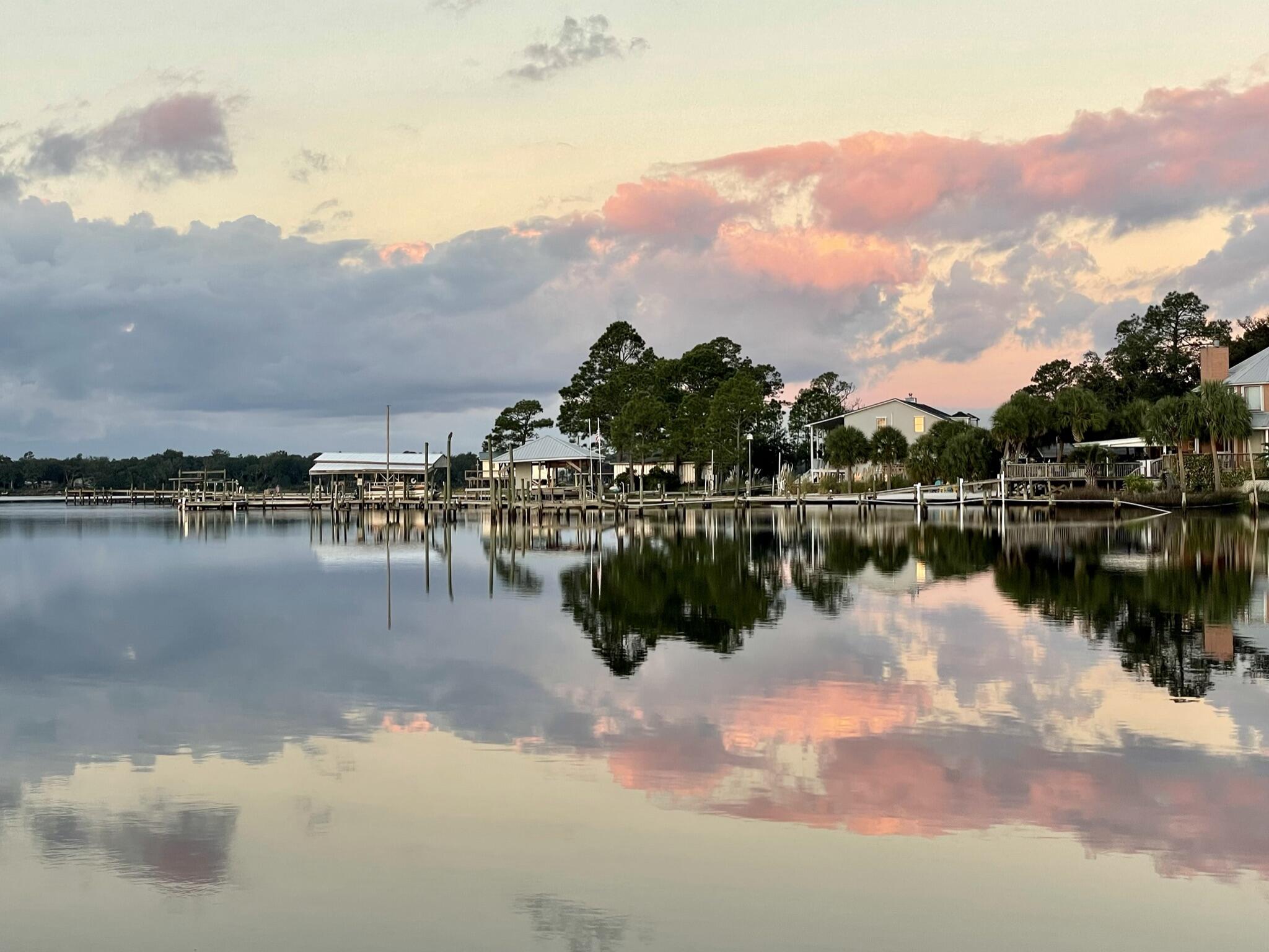 2975 Holley Point Road Navarre, FL 32566 - Photo 12 of 101 a view of a lake with houses