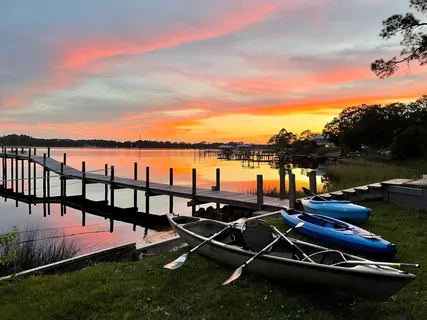 a spacious bedroom with a large bed and a large window