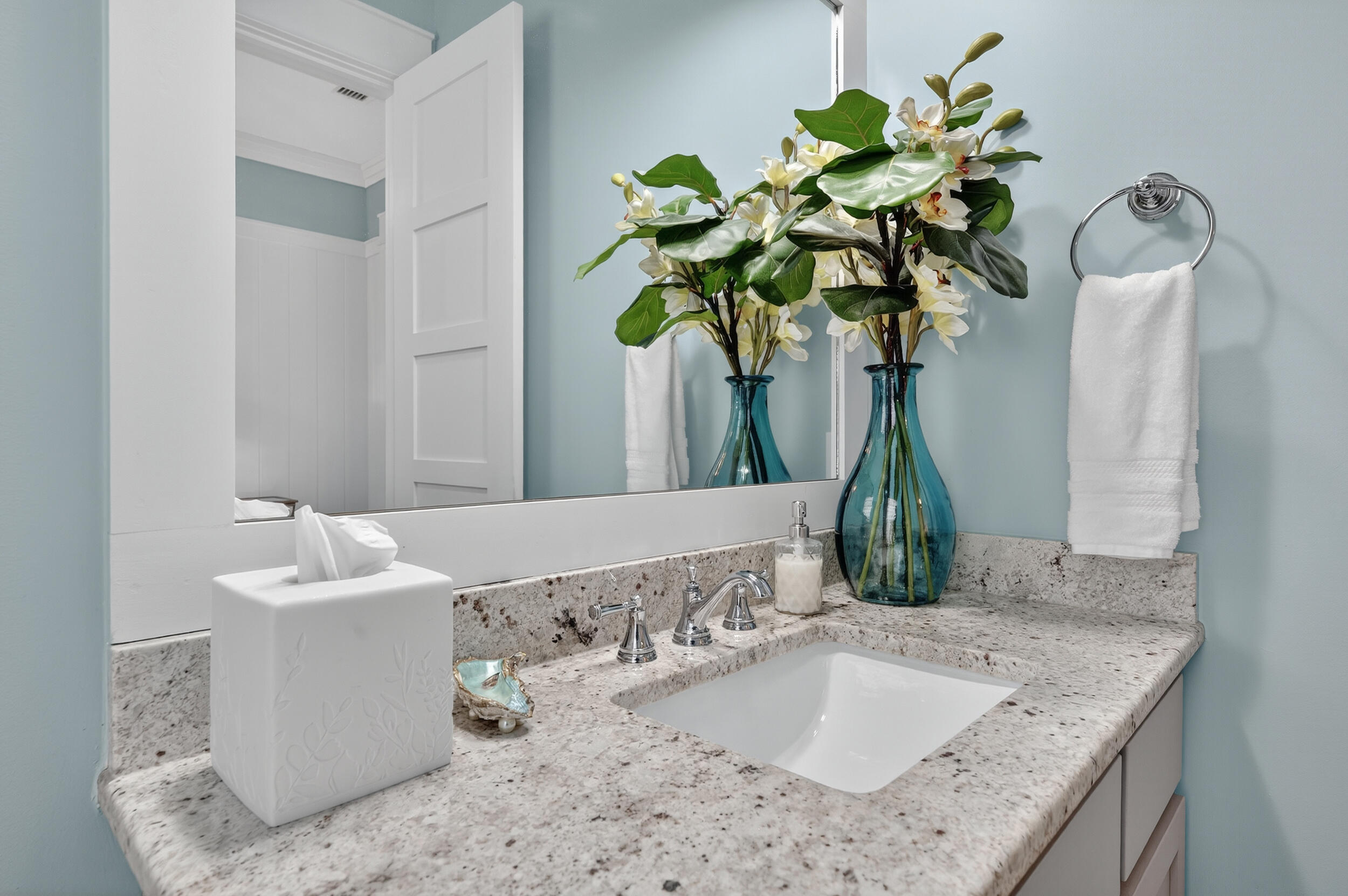 2975 Holley Point Road Navarre, FL 32566 - Photo 17 of 101 a bathroom with a granite countertop sink a mirror and vanity