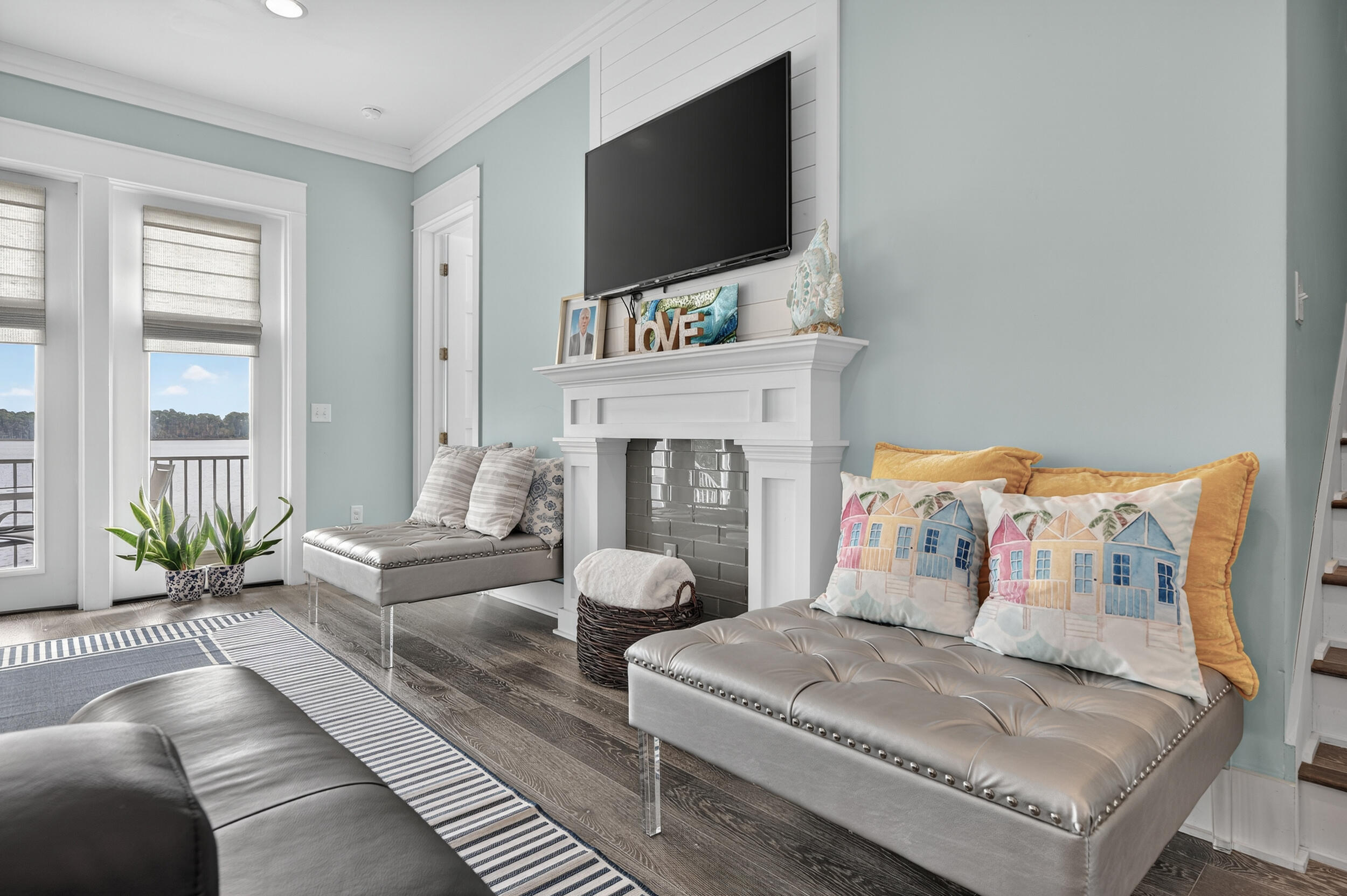 2975 Holley Point Road Navarre, FL 32566 - Photo 18 of 101 a living room with furniture a flat screen tv and a fireplace