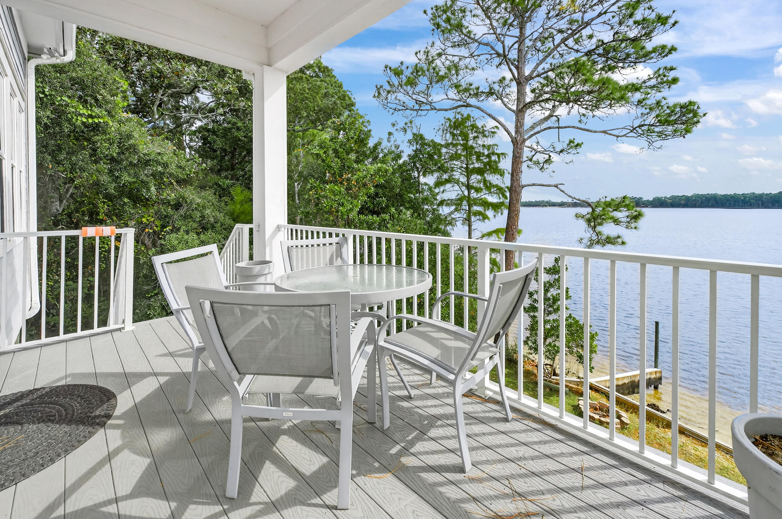 2975 Holley Point Road Navarre, FL 32566 - Photo 27 of 101 a view of a chair and table in the balcony