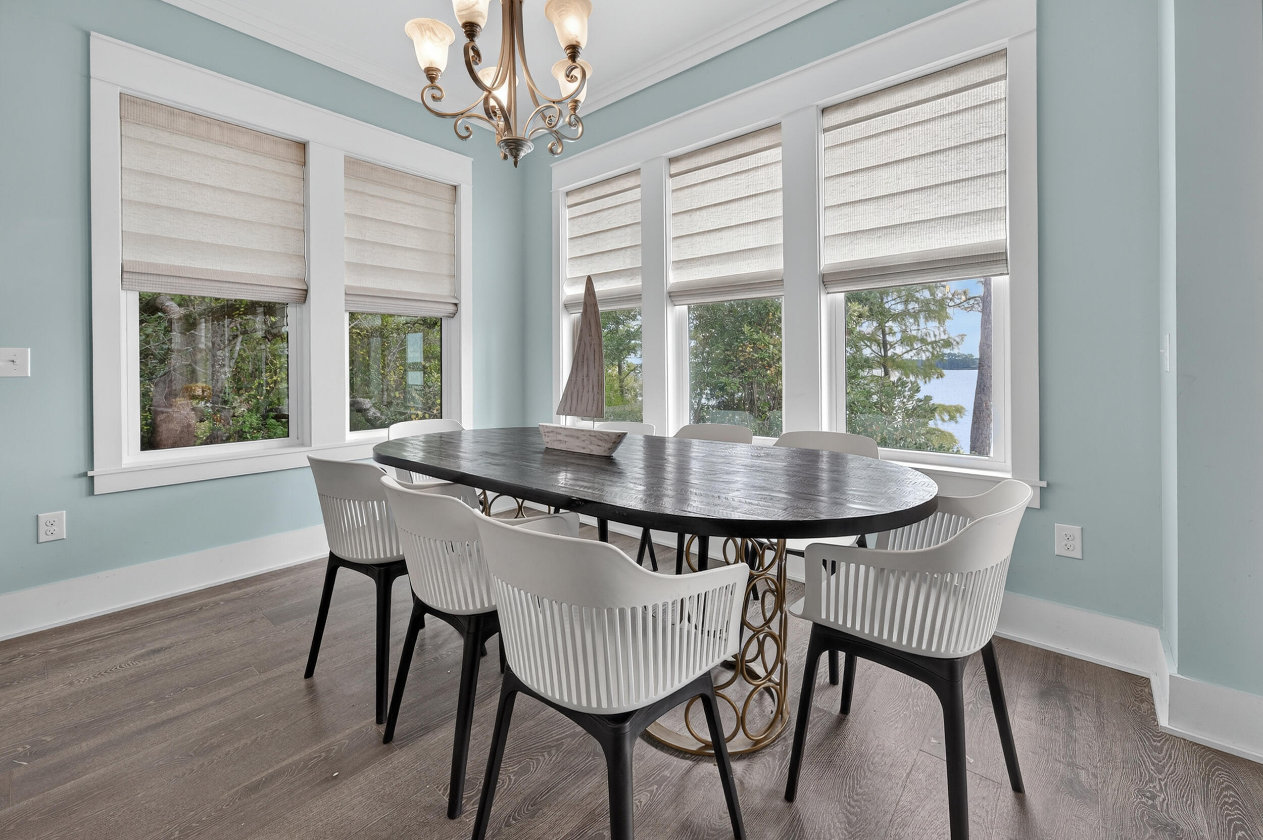 2975 Holley Point Road Navarre, FL 32566 - Photo 29 of 101 a view of a dining room with furniture window and wooden floor