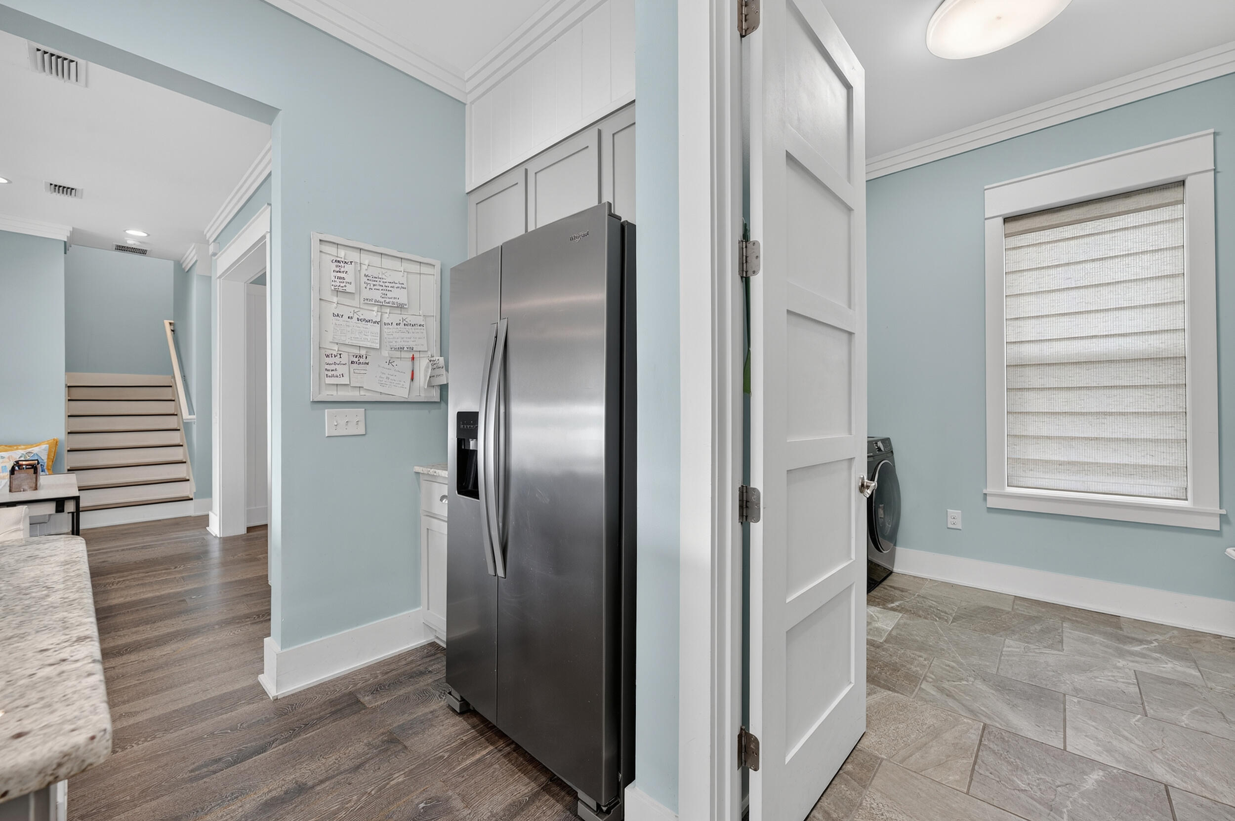 2975 Holley Point Road Navarre, FL 32566 - Photo 35 of 101 a view of a refrigerator in kitchen and an empty room