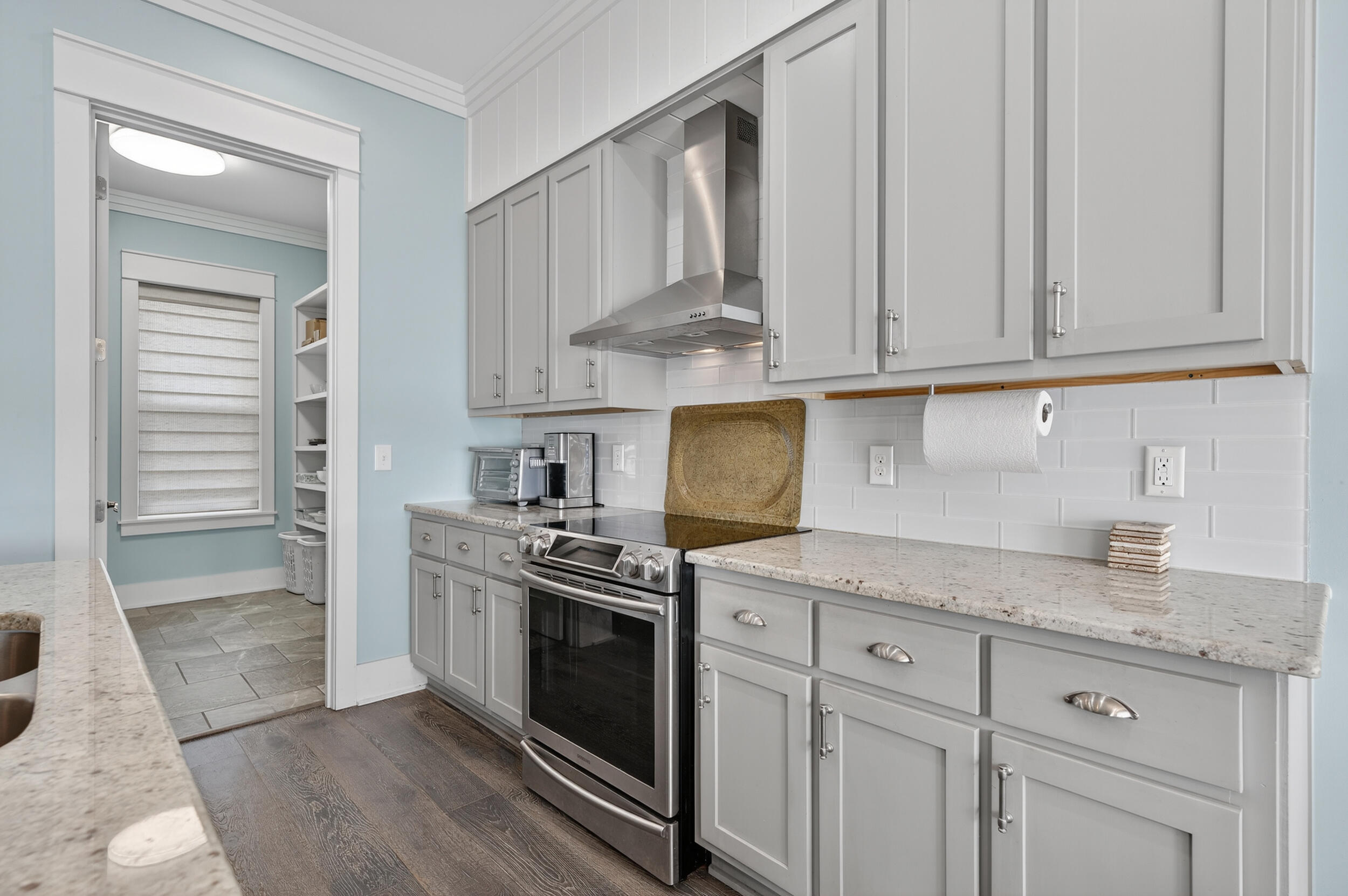 2975 Holley Point Road Navarre, FL 32566 - Photo 38 of 101 a kitchen with stainless steel appliances granite countertop a stove and a white cabinets