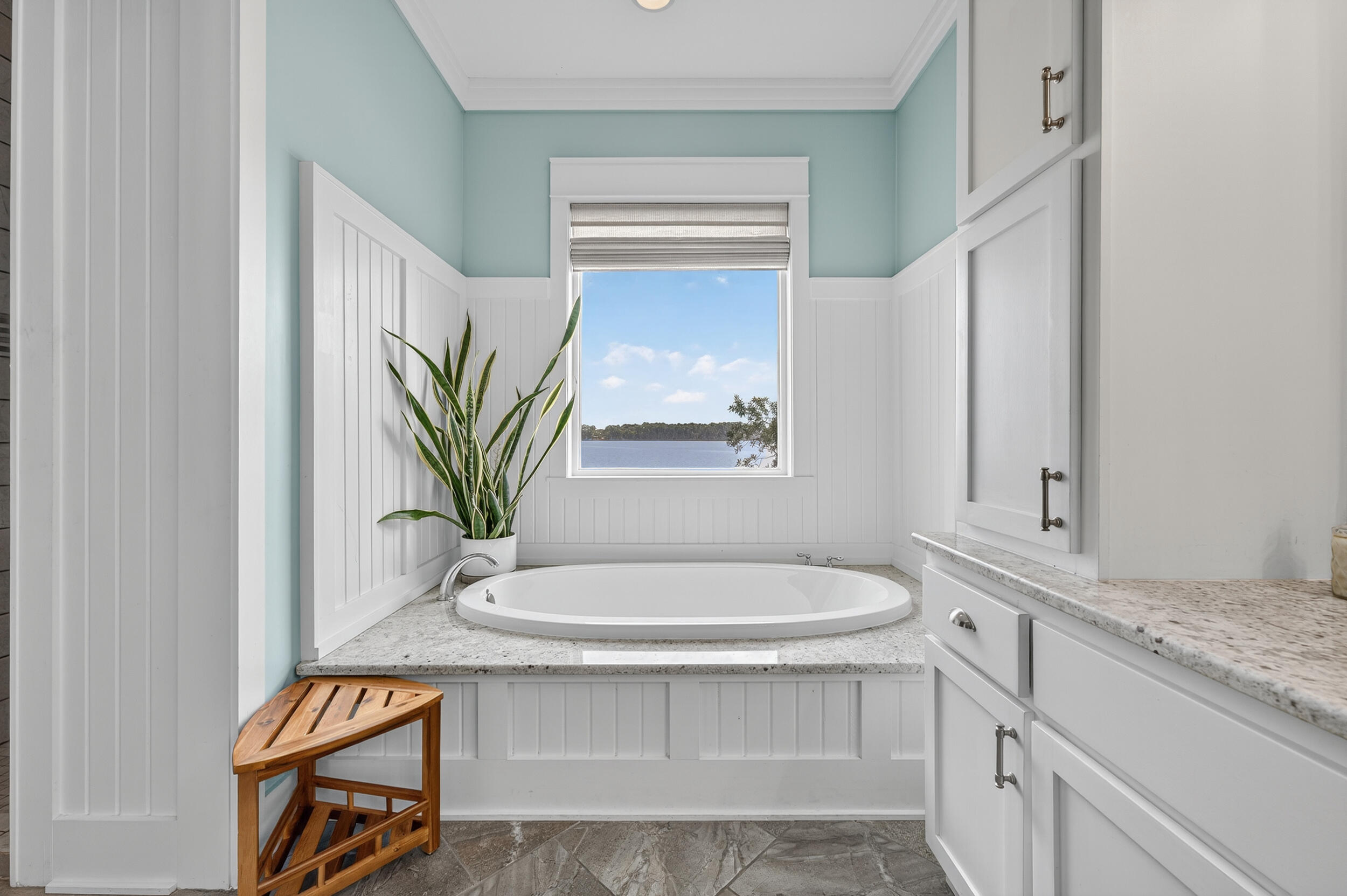 2975 Holley Point Road Navarre, FL 32566 - Photo 50 of 101 a bathroom with a sink and a mirror