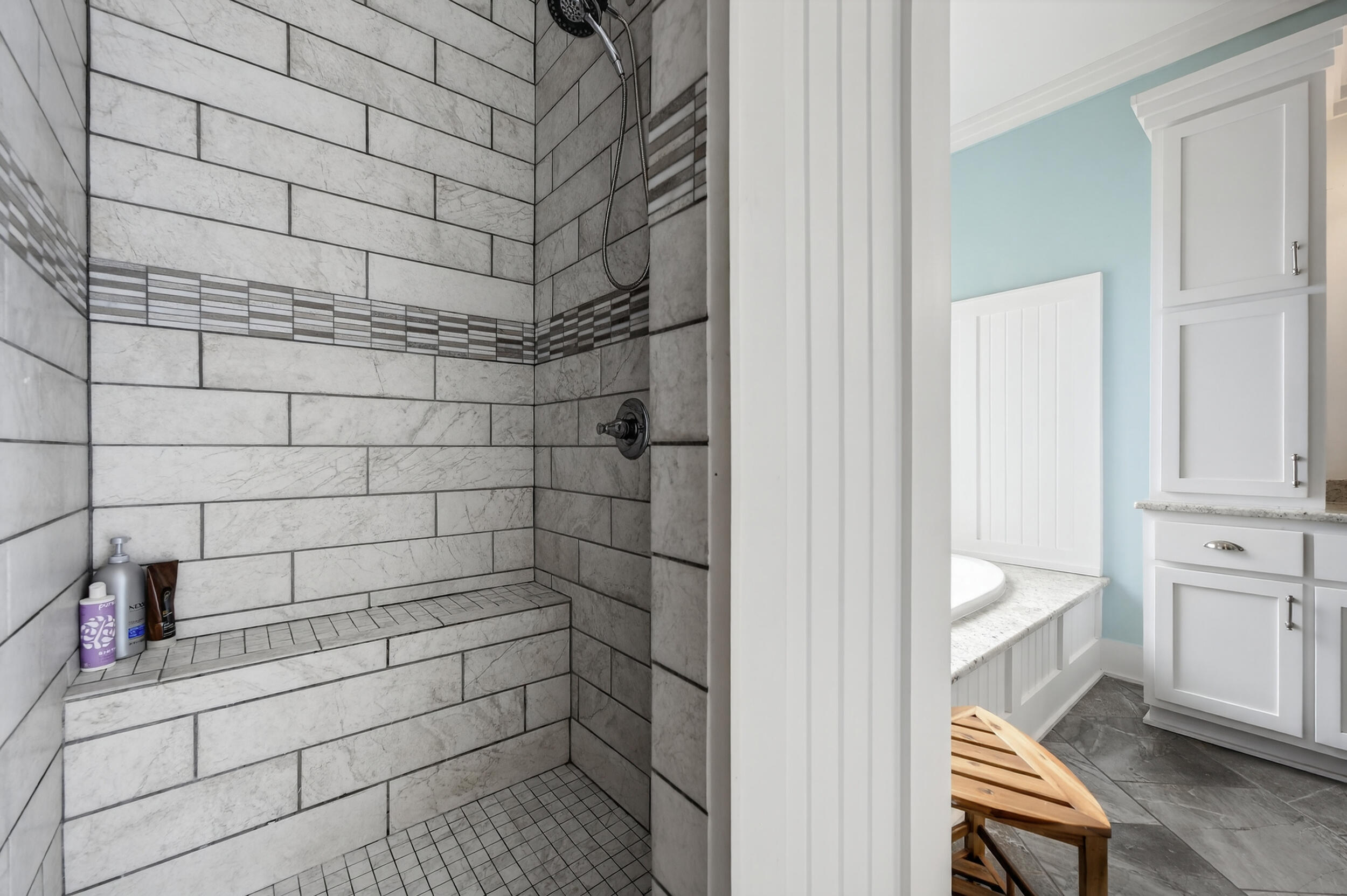 2975 Holley Point Road Navarre, FL 32566 - Photo 51 of 101 a bathroom with a bathtub and a shower