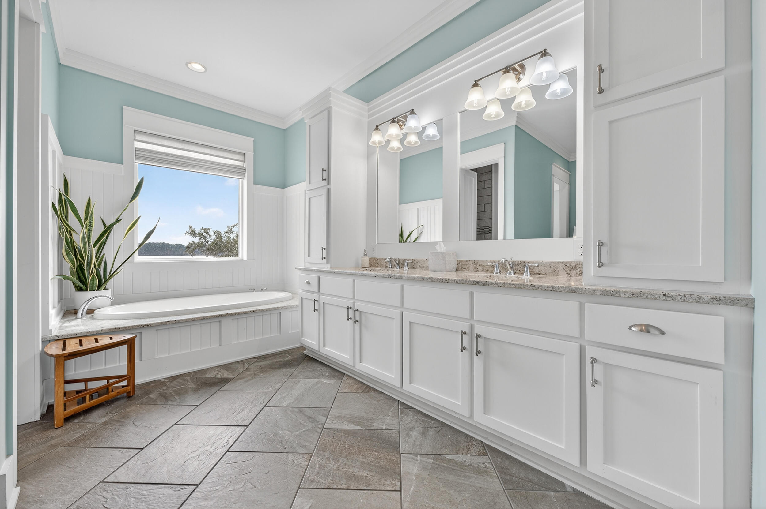 2975 Holley Point Road Navarre, FL 32566 - Photo 54 of 101 a bathroom with a sink a vanity and a mirror