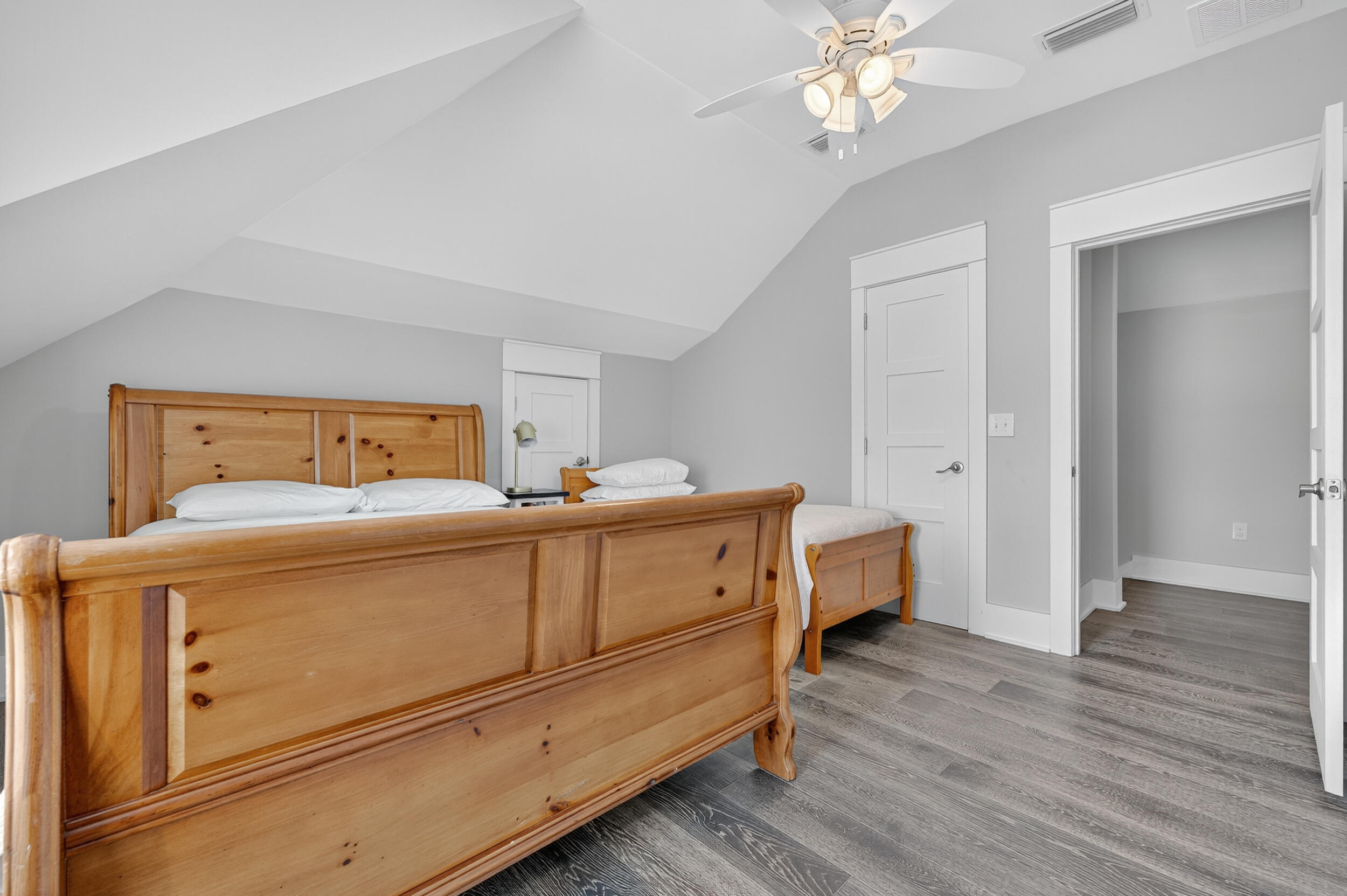 2975 Holley Point Road Navarre, FL 32566 - Photo 59 of 101 a room with a bed and wooden floor