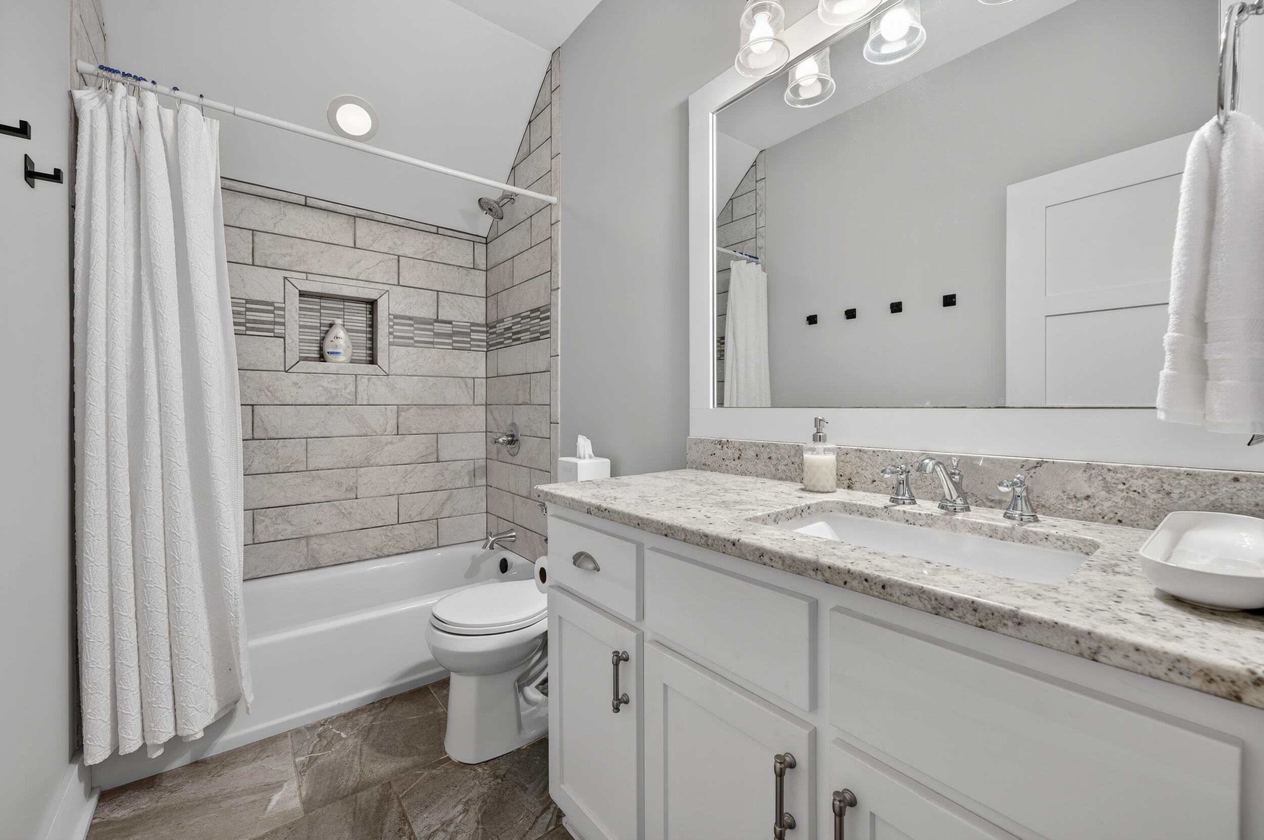 2975 Holley Point Road Navarre, FL 32566 - Photo 61 of 101 a bathroom with a granite countertop sink toilet and shower