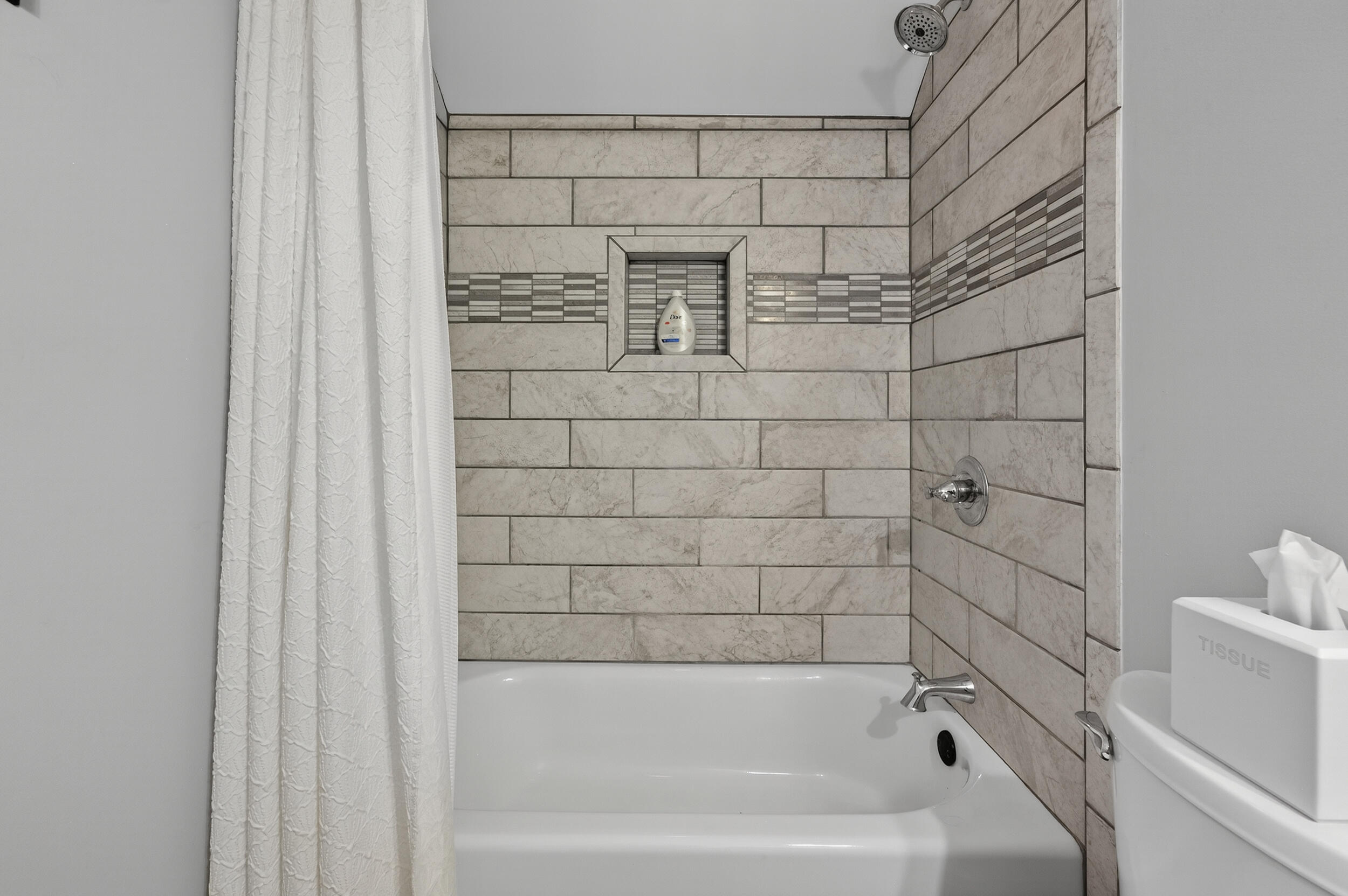 2975 Holley Point Road Navarre, FL 32566 - Photo 62 of 101 a bathroom with a bathtub