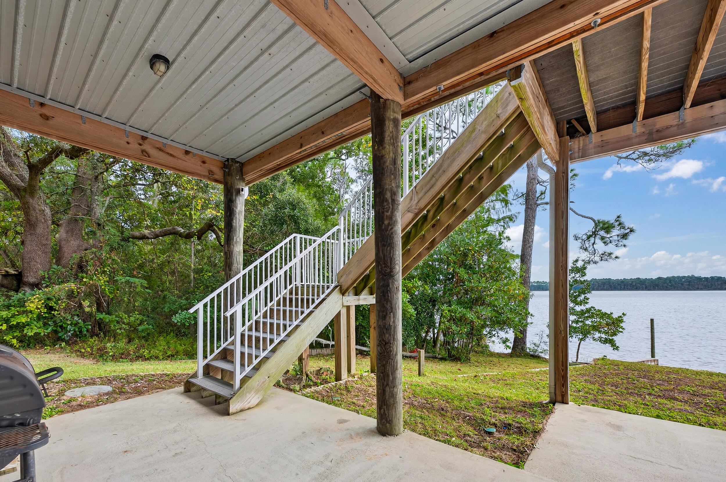 2975 Holley Point Road Navarre, FL 32566 - Photo 68 of 101 a view of a porch with a backyard