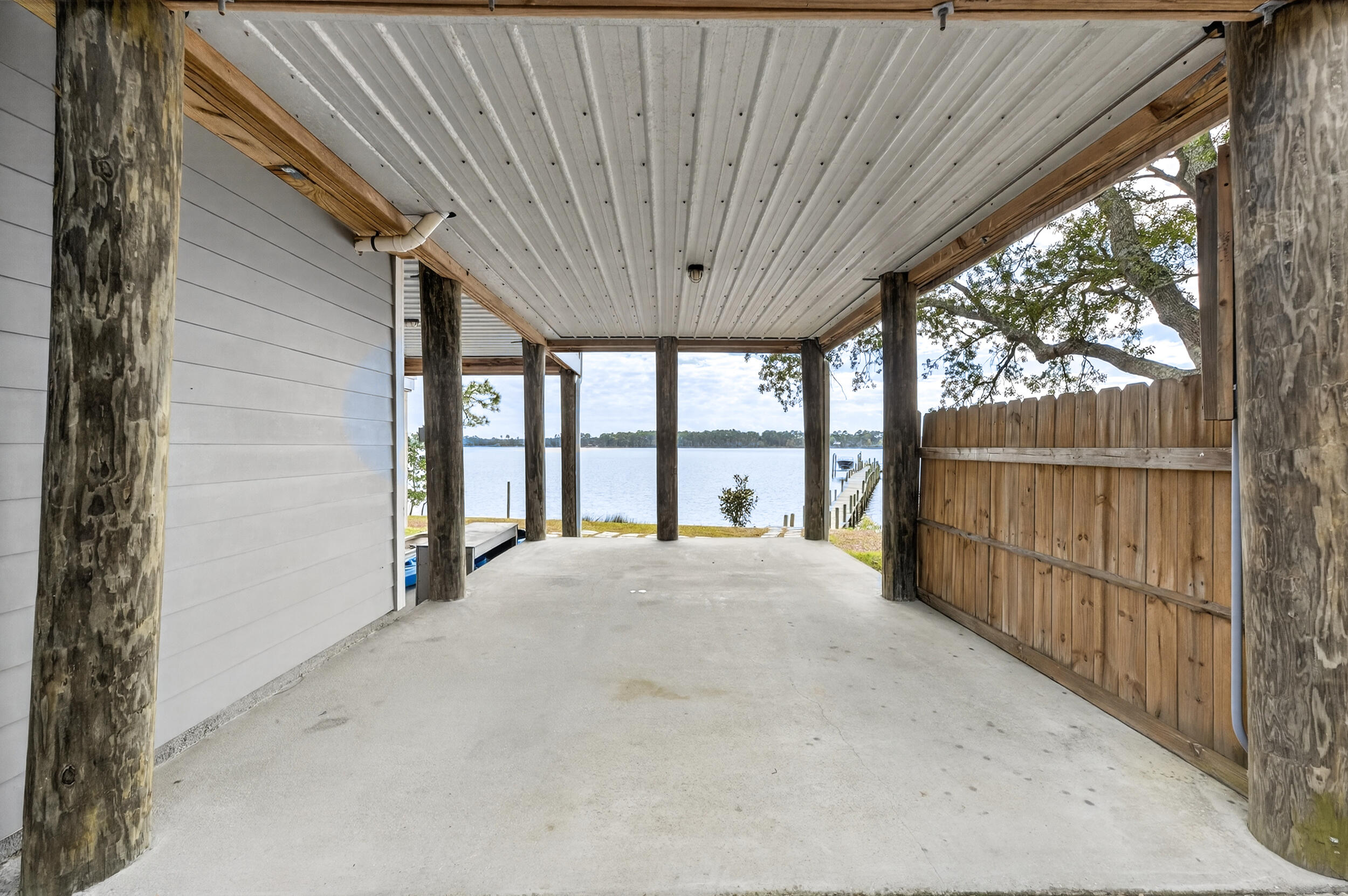 2975 Holley Point Road Navarre, FL 32566 - Photo 70 of 101 a view of an empty room with a large window