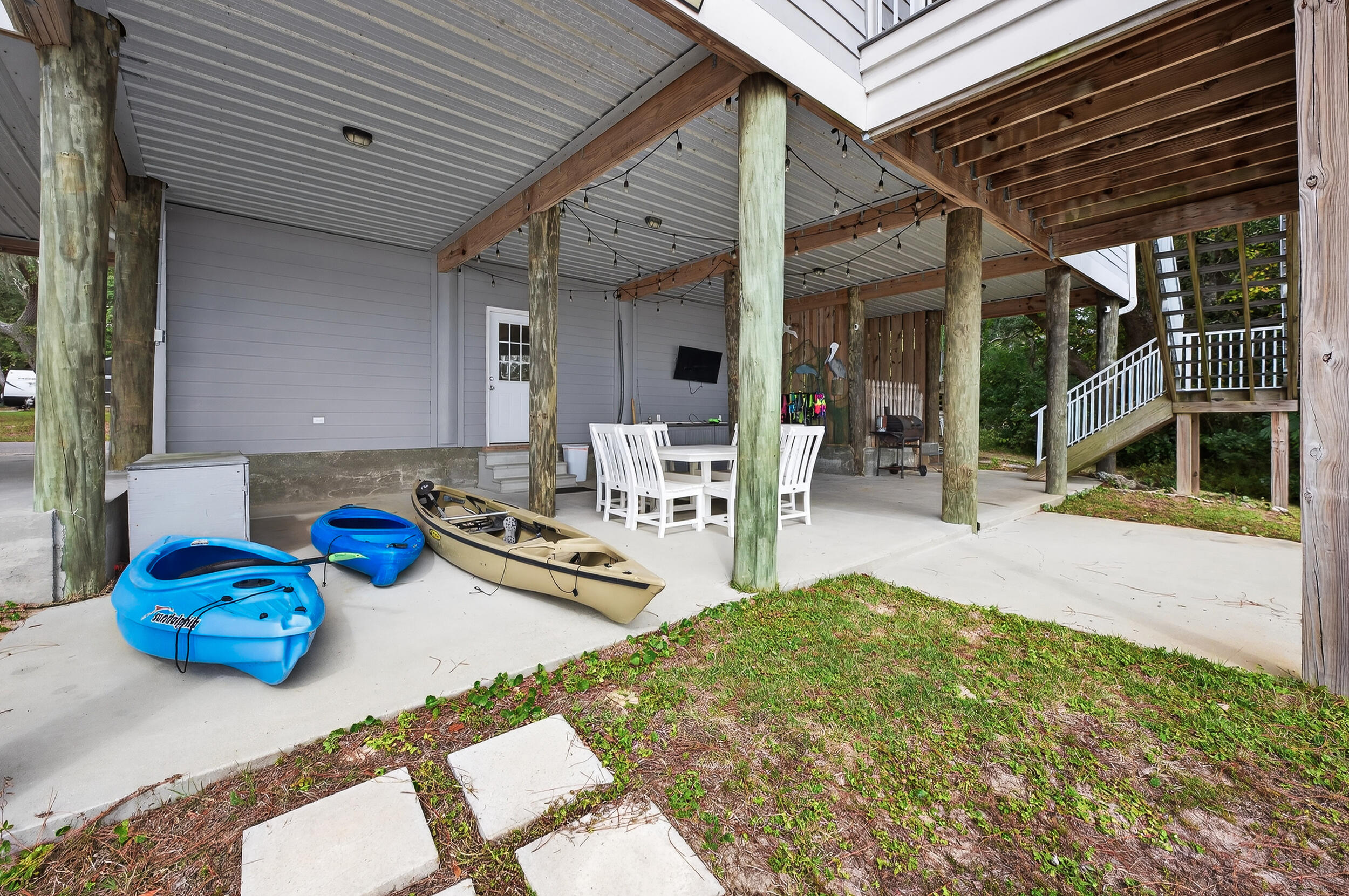 2975 Holley Point Road Navarre, FL 32566 - Photo 71 of 101 a view of a chairs and table in a patio