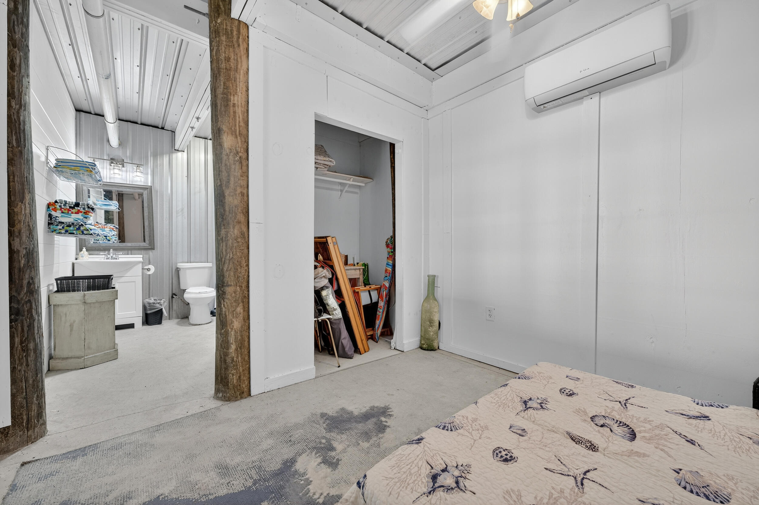 2975 Holley Point Road Navarre, FL 32566 - Photo 74 of 101 a bed room with a bed and a view of kitchen