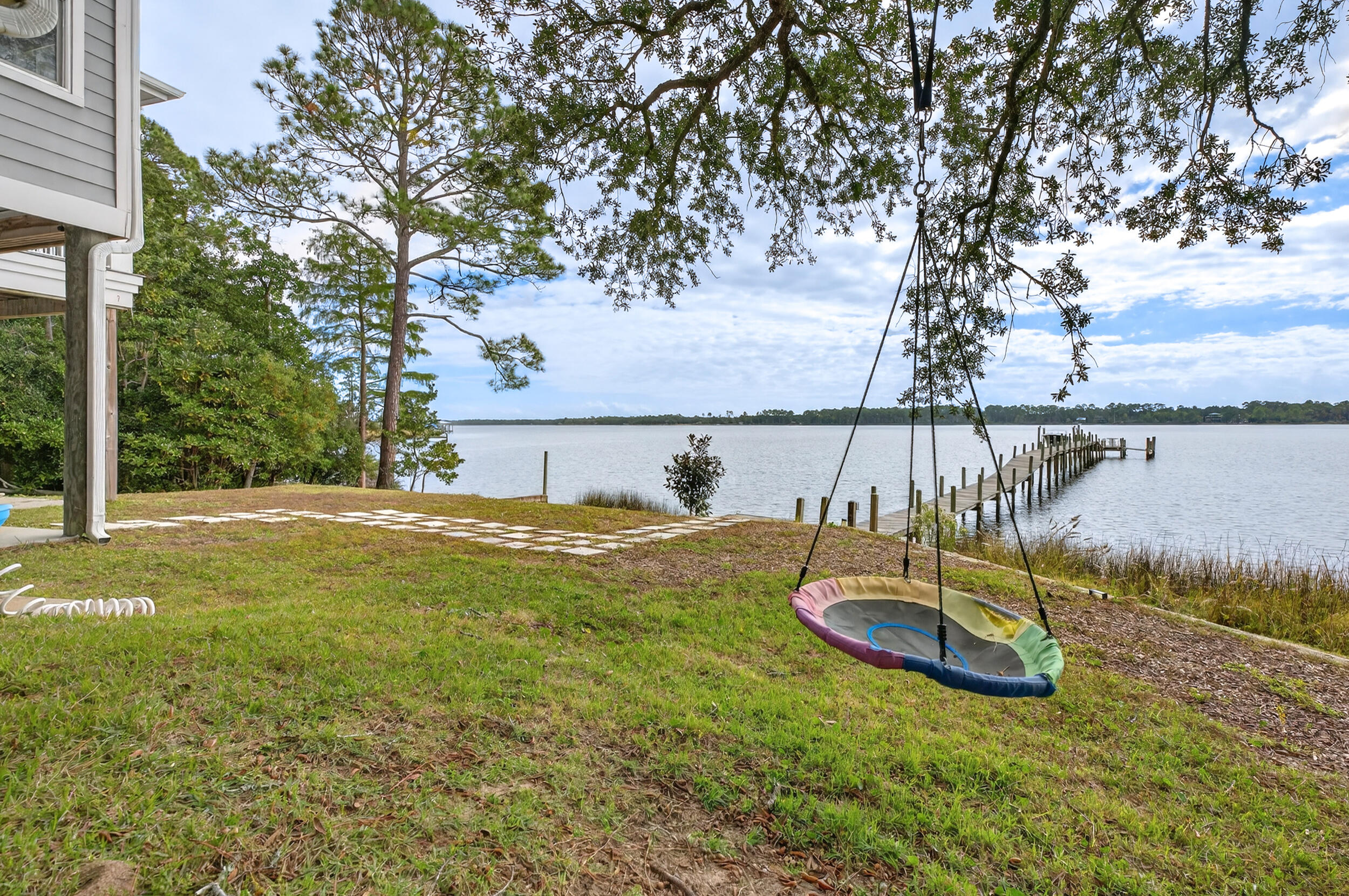 2975 Holley Point Road Navarre, FL 32566 - Photo 79 of 101 a view of a swimming pool with an outdoor space
