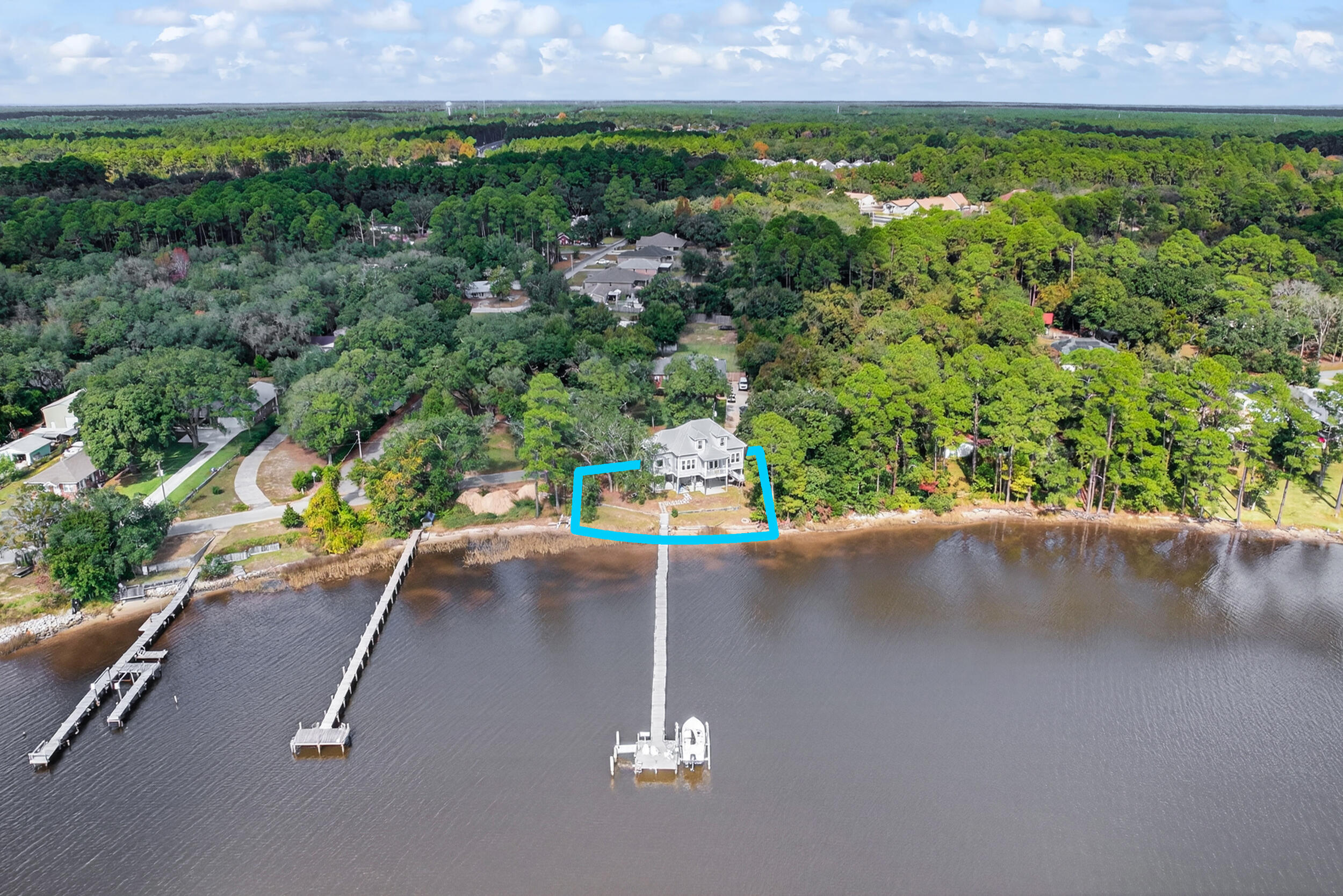 2975 Holley Point Road Navarre, FL 32566 - Photo 89 of 101 an aerial view of a house with a yard and lake view