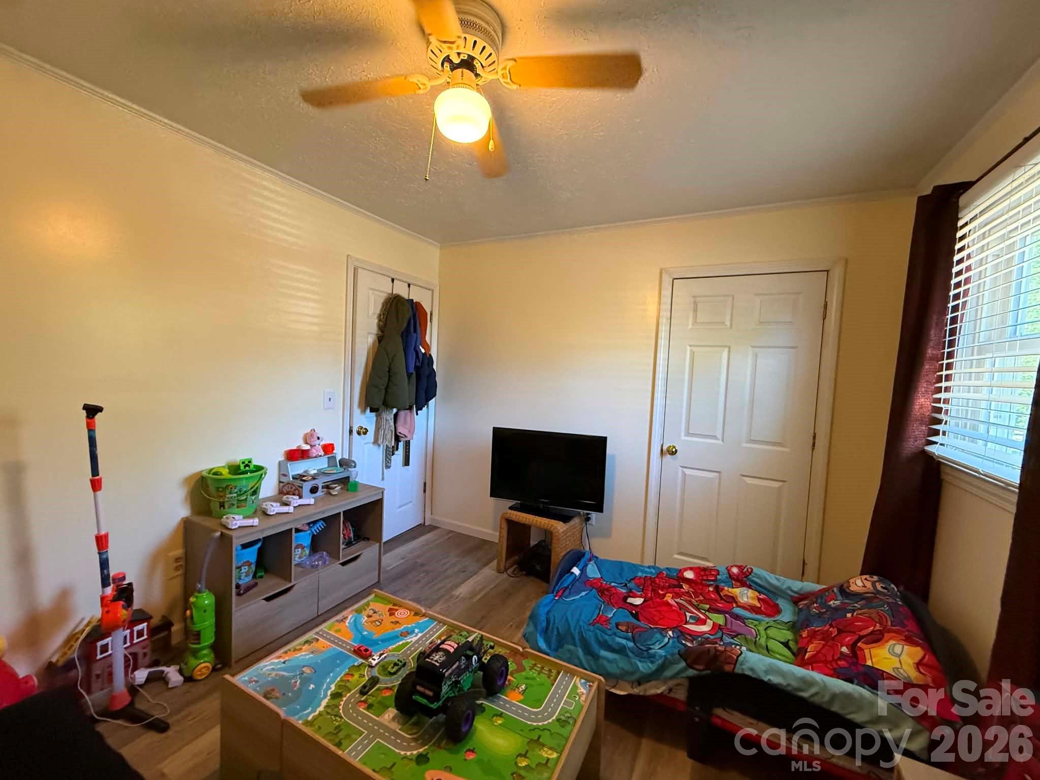 2121 Union Grove Road Lenoir, NC 28645 - Photo 24 of 38 a bedroom with bed and a tv