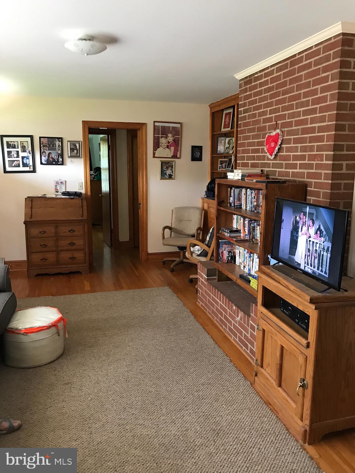 Living Room with brick fireplace