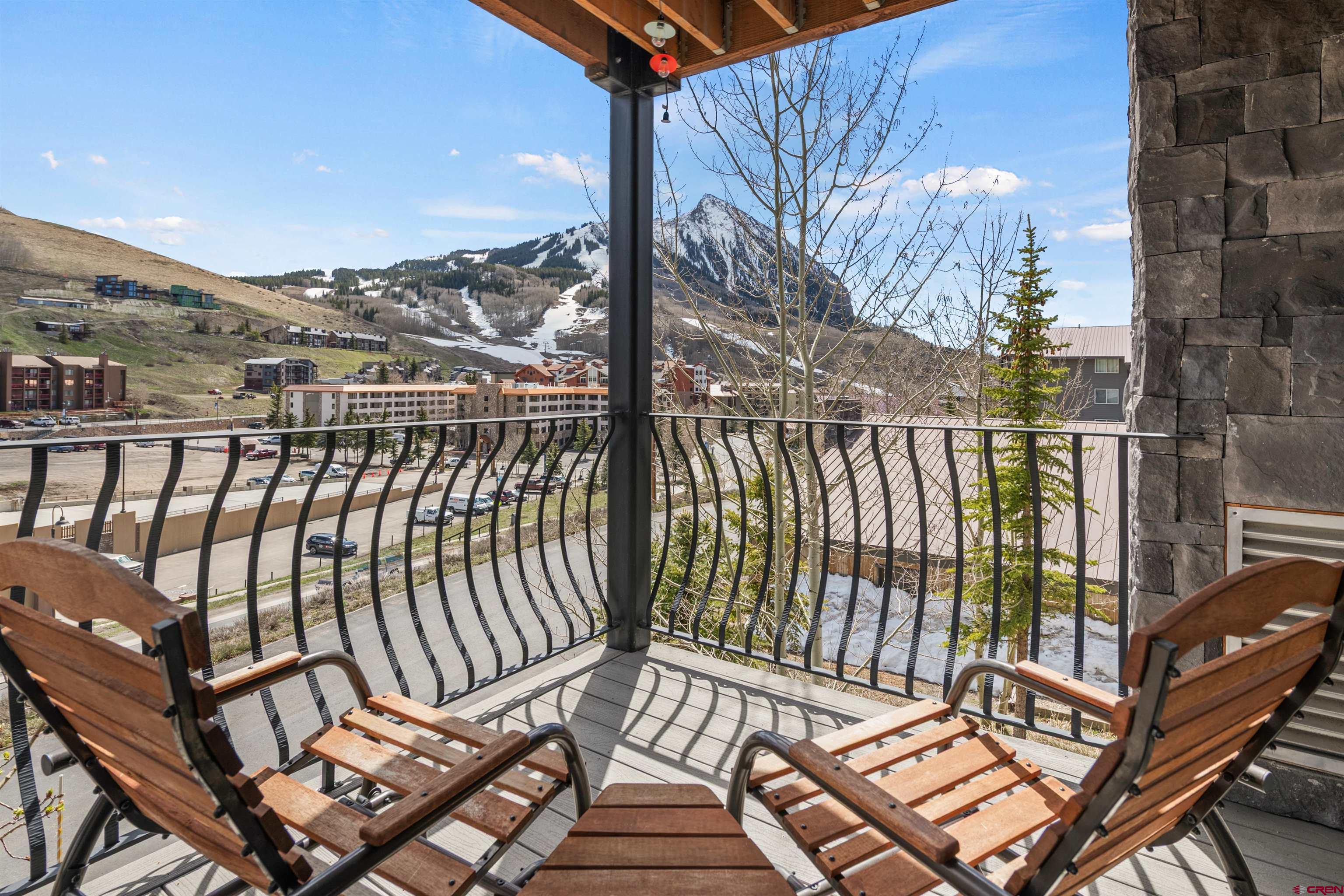 a view of a balcony with wooden floor