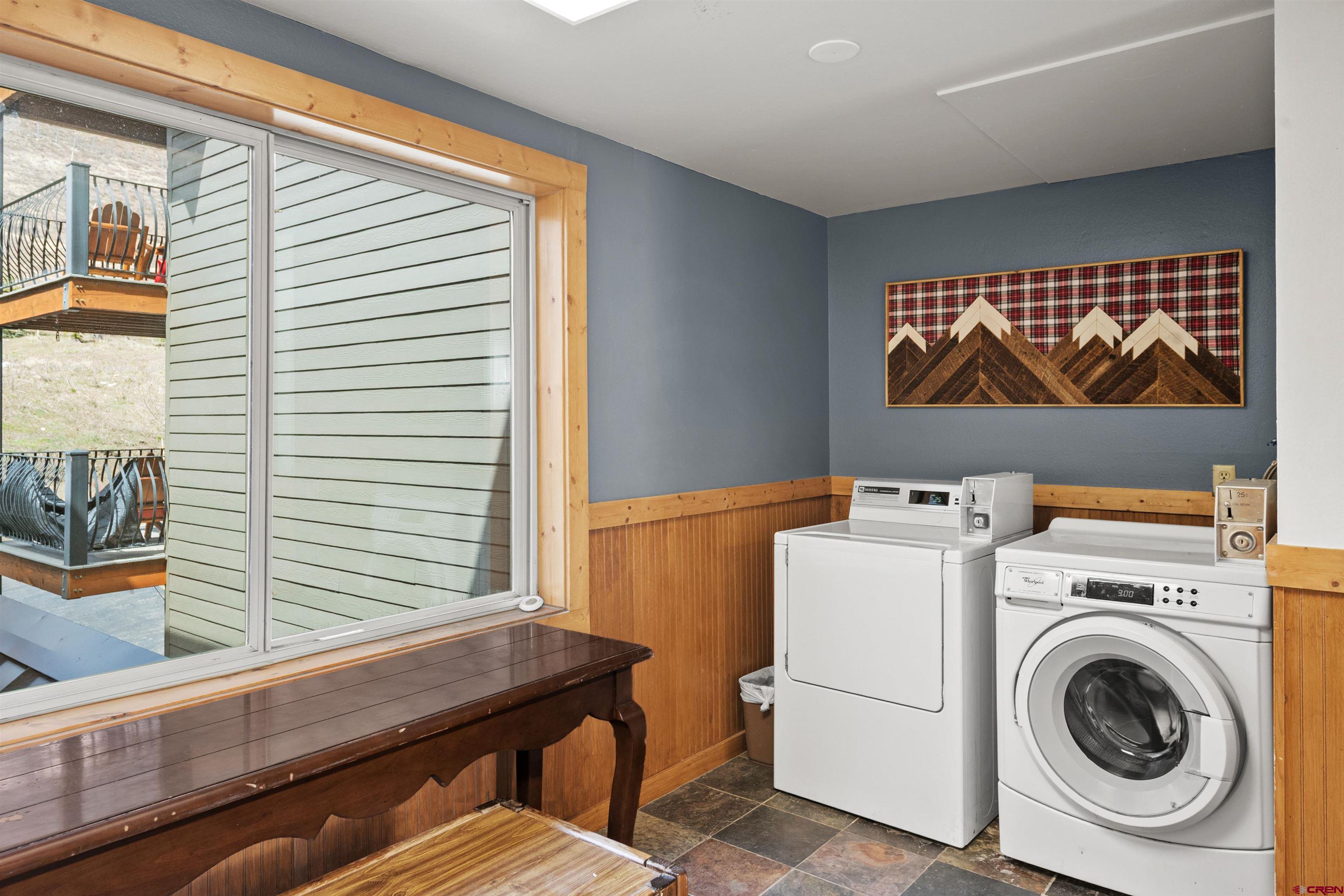 651 Gothic Road, Unit 306 Crested Butte, CO 81225 - Photo 22 of 24 a utility room with dryer and washer