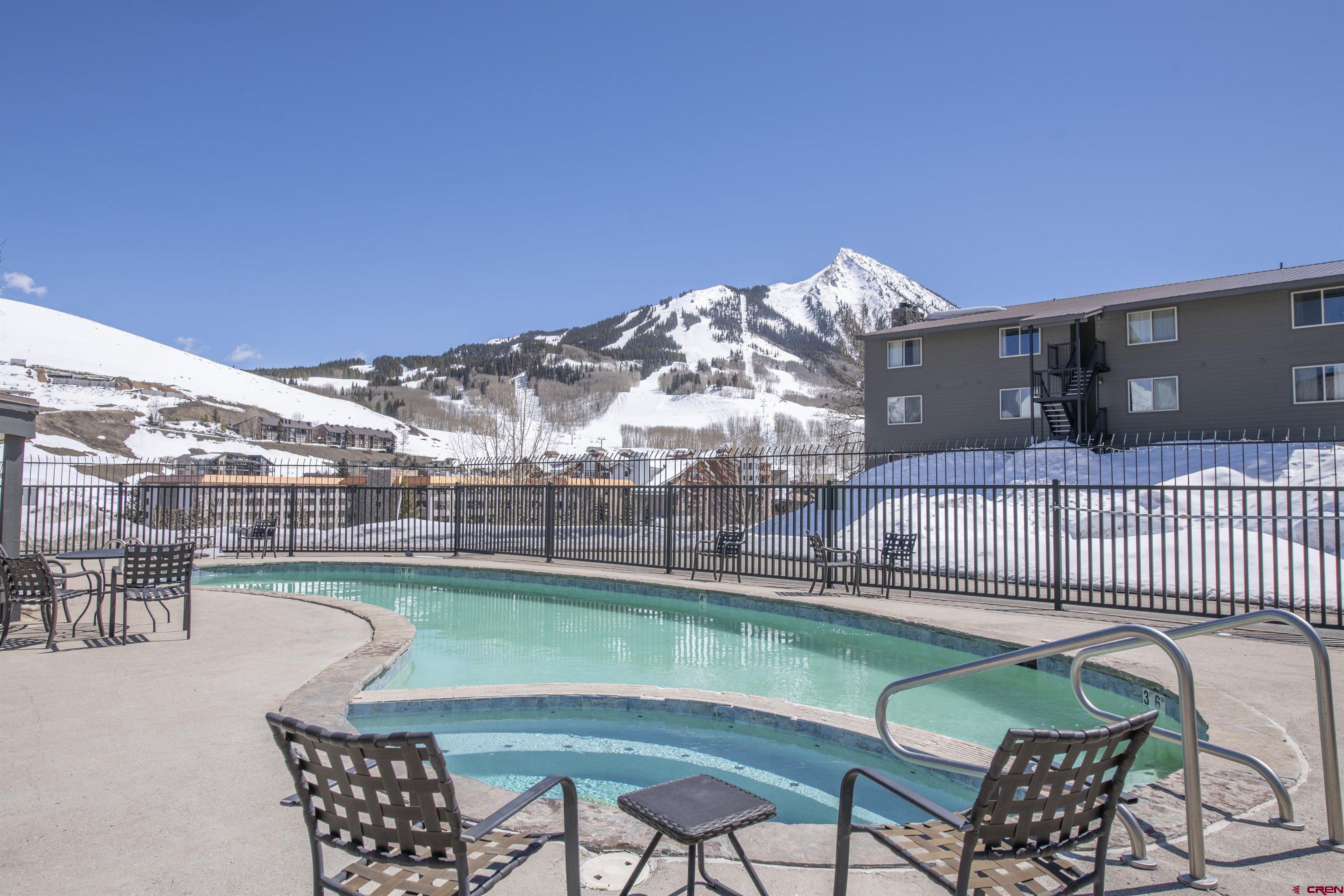 651 Gothic Road, Unit 306 Crested Butte, CO 81225 - Photo 23 of 24 a view of a chairs and table in the patio