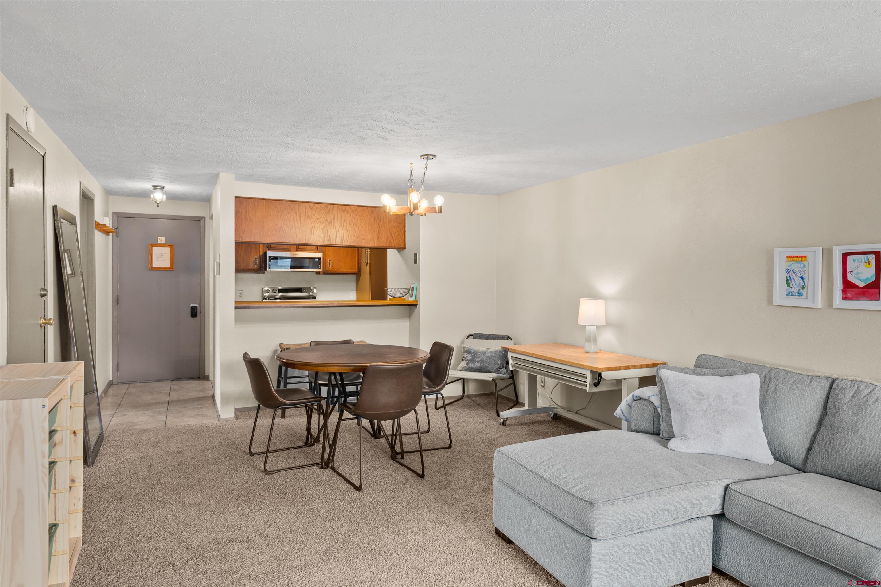 651 Gothic Road, Unit 306 Crested Butte, CO 81225 - Photo 10 of 24 a living room with furniture and a large window