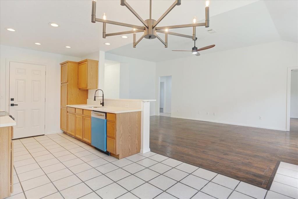 700 East 6th Street Bonham, TX 75418 - Photo 27 of 28 a room with a table and chandelier