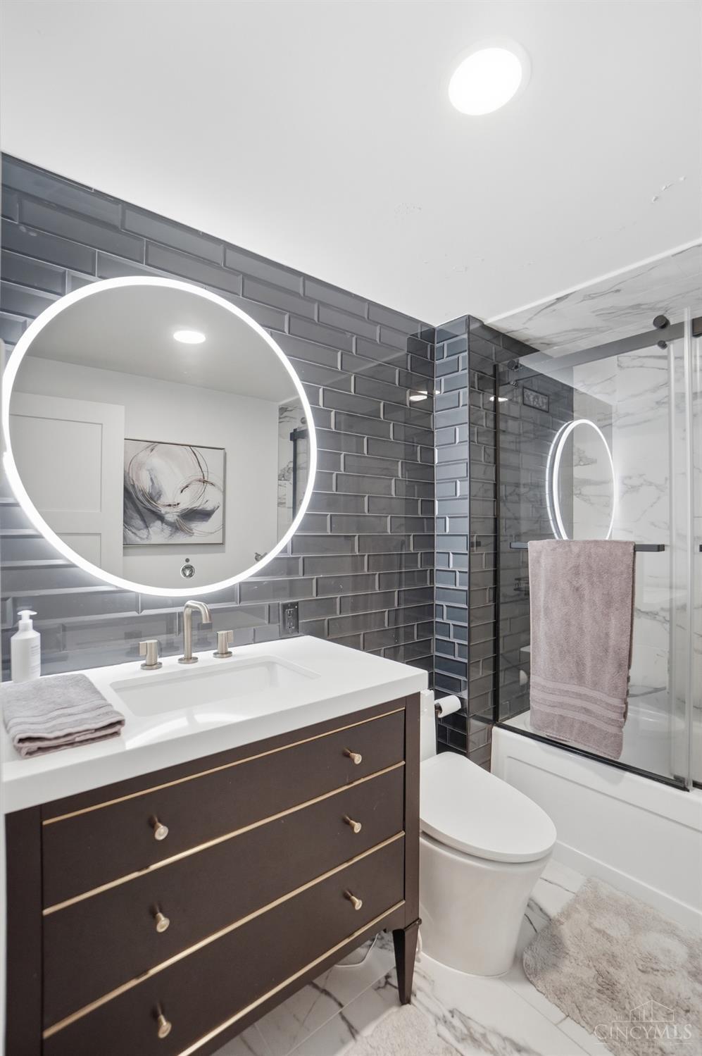 2324 Madison Road, Unit 303 Cincinnati, OH 45208 - Photo 20 of 33 Primary bathroom features include: extra deep soaking tub, LED accent vanity mirror, Brizo shower with adjustable head and hand held washer.