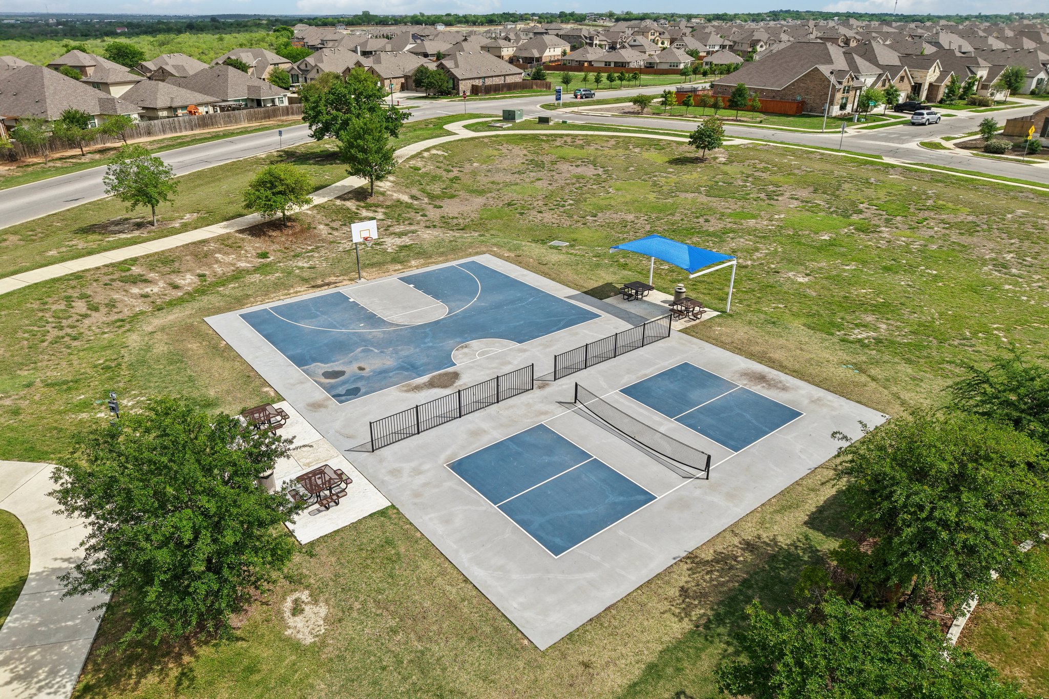 930 Nautical Loop Kyle, TX 78640 - Photo 23 of 25 You don't need to leave the community to enjoy sports court and pickleball!