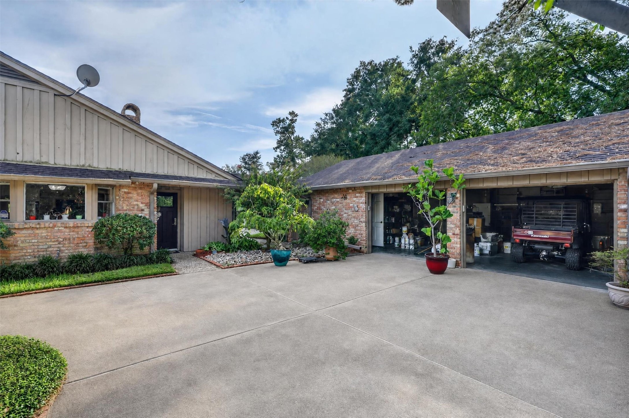 12625 Huffmeister Road Cypress, TX 77429 - Photo 9 of 50 Imagine pulling into your spacious private courtyard after a day exploring your ranch. With an oversized garage, plenty of parking, and room for your recreational vehicles and outdoor equipment, there's space to enjoy your favorite hobbies. Whether you're working on a weekend project, preparing for your next adventure, or simply coming home to relax, this property offers the convenience, flexibility, and freedom of true Texas ranch living.