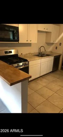 a kitchen with a stove and a microwave
