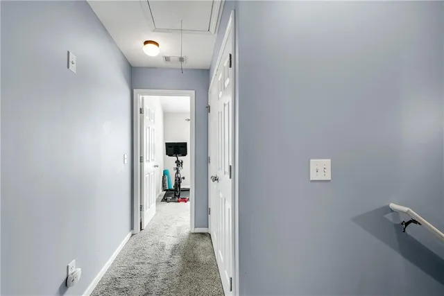 a view of a livingroom with furniture and a flat screen tv