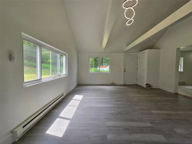 a view of an empty room and window