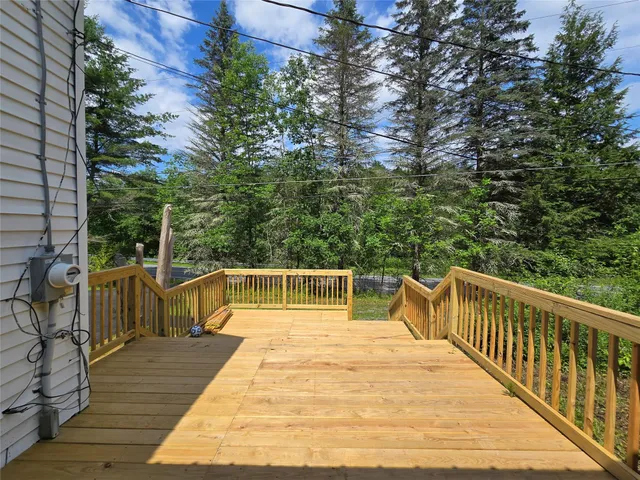 a view of balcony with deck and wooden floor