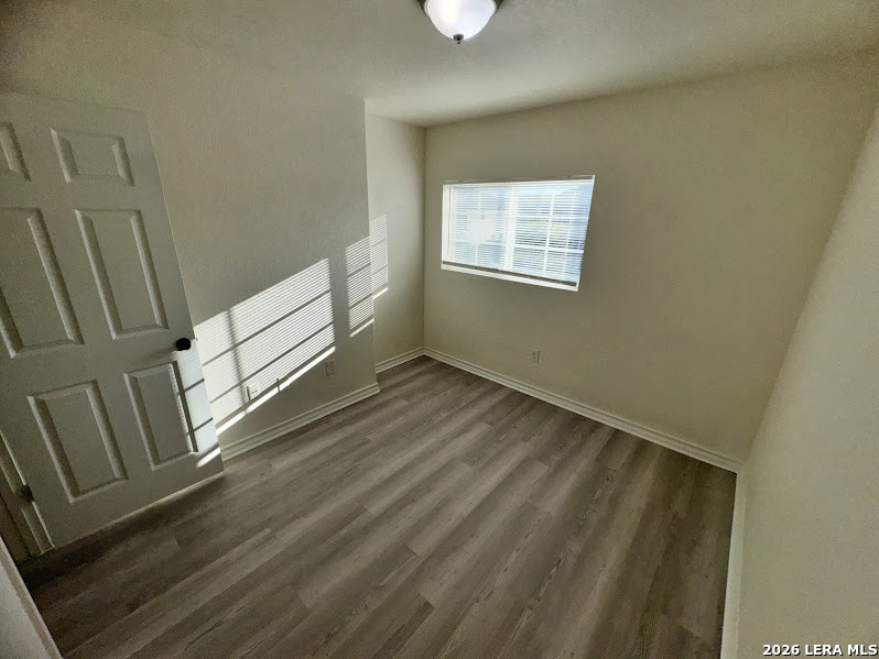 16808 Dancing Ava, Unit 2 Selma, TX 78154 - Photo 13 of 15 a view of an empty room with wooden floor